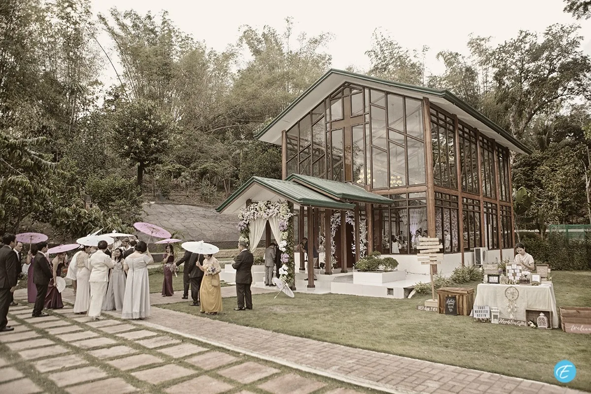 Wedding guests outside the farm's glass chapel